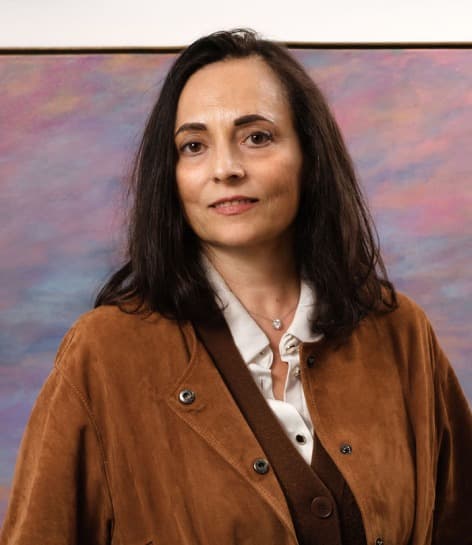 Martine Rachel Ovadia in front of one of her paintings