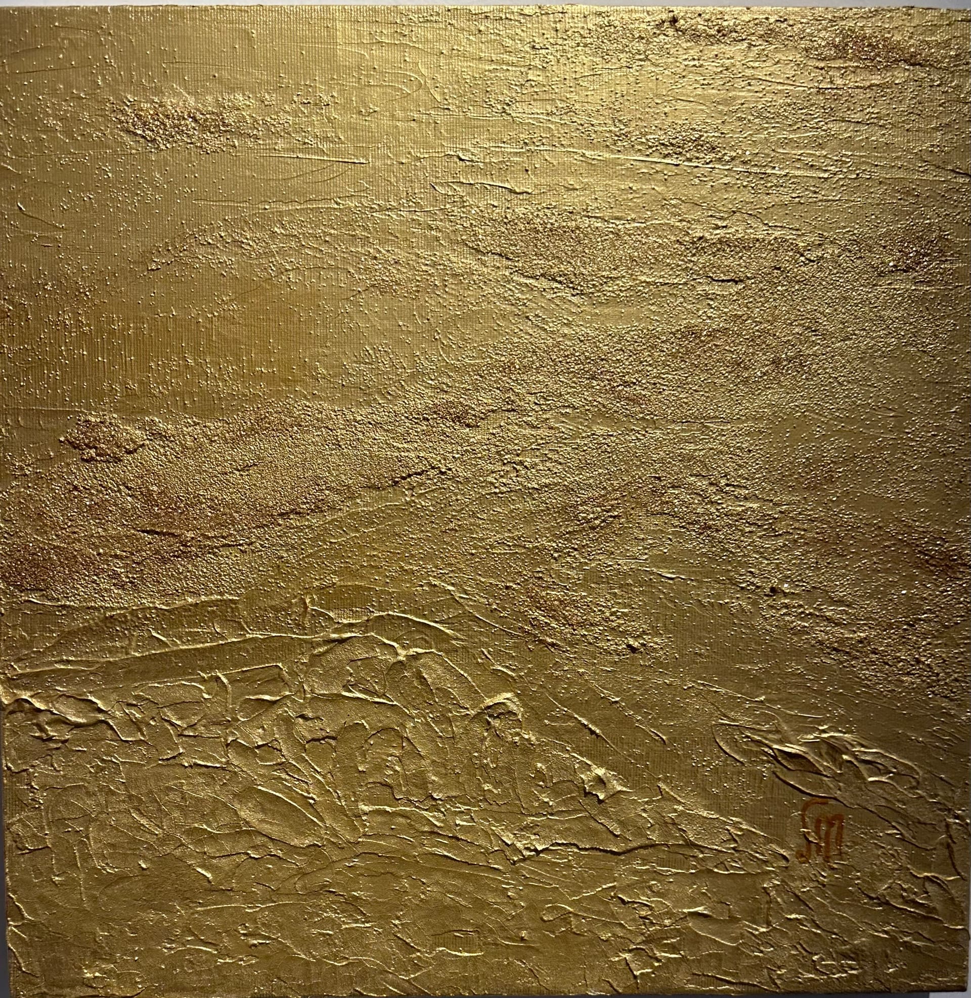 Gold monochrome painting with granular sand-like texture above and thick palette-knife relief in the lower third