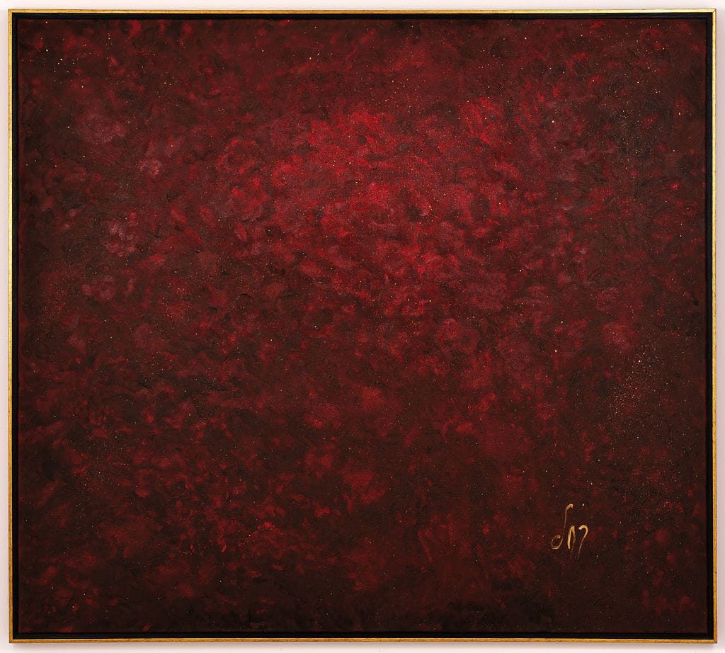 Monochrome abstract painting in deep crimson and burgundy, with a mottled, velvety texture and a lighter red center