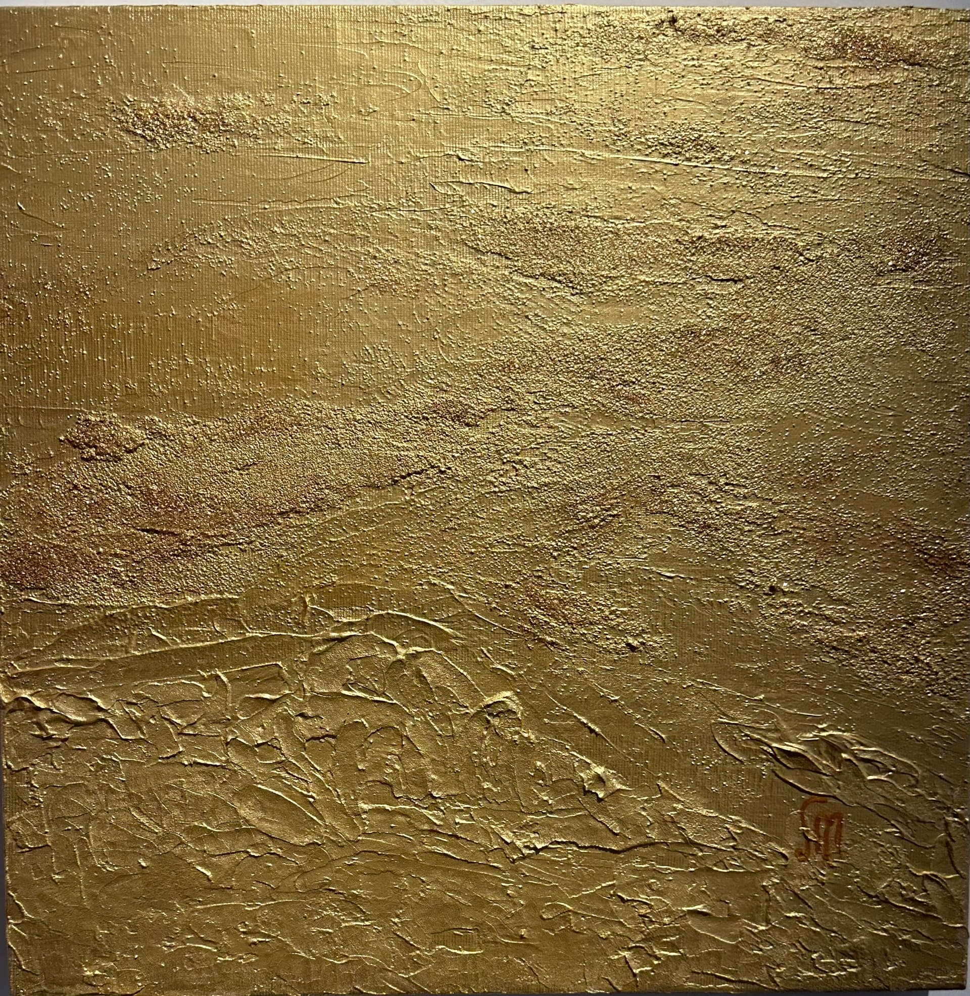 Gold monochrome painting with granular sand-like texture above and thick palette-knife relief in the lower third